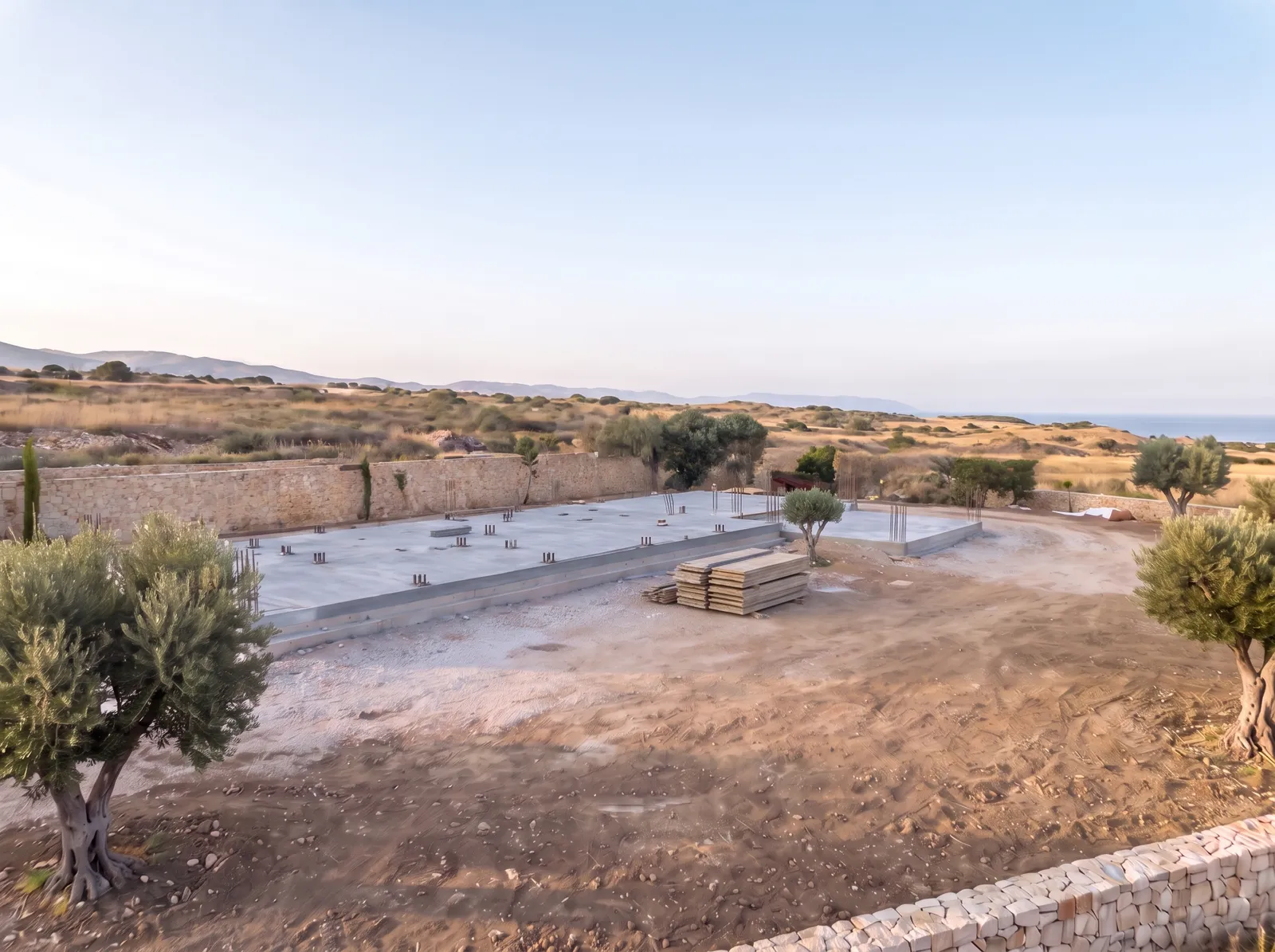 Concrete foundation slab with anchor bolts for the steel columns